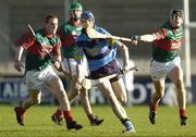 13 November 2005; Brian Hogan, UCD, in action against Barry Whelahan, left, and Rory Hanniffy, Birr. Leinster Club Senior Hurling Championship Quarter-Final, UCD v Birr, Parnell Park, Dublin. Picture credit: Brian Lawless / SPORTSFILE