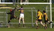 13 November 2005; Ray Cosgrove, Kilmacud Crokes punches the ball to the net despite the challenge of St Peters goalkeeper Johnny O'Connor. Leinster Club Senior Football Championship Quarter-Final, St. Peter's v Kilmacud Crokes, Pairc Tailteann, Navan, Co. Meath. Picture credit: Damien Eagers / SPORTSFILE