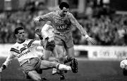 21 April 1991; Tom McNulty of Dundalk is tackled by Pat Duggan of Cork City during the Bord Gais National League Premier Division match between Cork City and Dundalk at Turners Cross in Cork. Photo by David Maher/Sportsfile