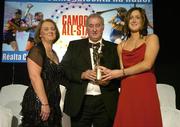 12 November 2005; Catherine O'Loughlin, from Wexford, who was presented with her award by Ossie Kilkenny, Chairperson, of the Irish Sports Council and Miriam O'Callaghan, left, President, Cumann Camogaiochta na nGael, at the 2005 Camogie All-Star Awards, in association with O'Neills. Citywest Hotel, Dublin. Picture credit: Brendan Moran / SPORTSFILE