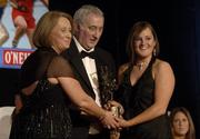12 November 2005; Ciara Lucey, from Dublin, who was presented with her award by Ossie Kilkenny, Chairperson, of the Irish Sports Council and Miriam O'Callaghan, left, President, Cumann Camogaiochta na nGael, at the 2005 Camogie All-Star Awards, in association with O'Neills. Citywest Hotel, Dublin. Picture credit: Ray McManus / SPORTSFILE
