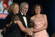 12 November 2005; Claire Grogan, from Tipperary, who was presented with her award by Ossie Kilkenny, Chairperson, of the Irish Sports Council and Miriam O'Callaghan, left, President, Cumann Camogaiochta na nGael, at the 2005 Camogie All-Star Awards, in association with O'Neills. Citywest Hotel, Dublin. Picture credit: Ray McManus / SPORTSFILE