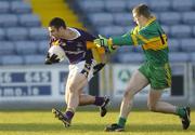 20 November 2005; Ciaran Kelleher, Kilmacud Crokes, in action against Niall McNamee, Rhode. Leinster Club Senior Football Championship Semi-Final, Kilmacud Crokes v Rhode, O'Moore Park, Portlaoise, Co. Laois. Picture credit: Brian Lawless / SPORTSFILE