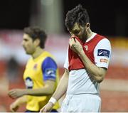 4 April 2014; St Patrick's Athletic's Killian Brennan at the end of the game after being sent off by referee Padraic Sutton. Airtricity League Premier Division, St Patrick's Athletic v Dundalk, Richmond Park, Dublin. Picture credit: David Maher / SPORTSFILE