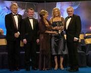 19 November 2005; Angela Walsh from Cork, 2nd from right, is presented with her All Star award by An Taoiseach Bertie Ahern TD, and Geraldine Giles, President of the Ladies Gaelic Football Association, in the company of Tony Towell of O'Neills, left, and Pol O Gallchoir of TG4, 2nd from left, at the O'Neills TG4 Ladies GAA All-Star Awards. Citywest Hotel, Dublin. Picture credit: Brendan Moran / SPORTSFILE