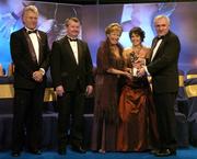 19 November 2005; Leona Tector, from Wexford, 2nd from right, is presented with her All Star award by An Taoiseach Bertie Ahern TD, and Geraldine Giles, President of the Ladies Gaelic Football Association, in the company of Tony Towell of O'Neills, left, and Pol O Gallchoir of TG4, 2nd from left, at the O'Neills TG4 Ladies GAA All-Star Awards. Citywest Hotel, Dublin. Picture credit: Brendan Moran / SPORTSFILE
