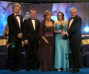 19 November 2005; Briege Corkery, from Cork, 2nd from right, is presented with her All Star award by An Taoiseach Bertie Ahern TD, and Geraldine Giles, President of the Ladies Gaelic Football Association, in the company of Tony Towell of O'Neills, left, and Pol O Gallchoir of TG4, 2nd from left, at the O'Neills TG4 Ladies GAA All-Star Awards. Citywest Hotel, Dublin. Picture credit: Brendan Moran / SPORTSFILE