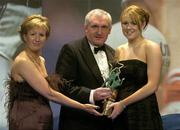 19 November 2005; Claire Shanahan, from Roscommon, is presented with her Leinster Young Player of the Year award by An Taoiseach Bertie Ahern TD and Geradline Giles, President of the Ladies Gaelic Football Association, at the O'Neills TG4 Ladies GAA All-Star Awards. Citywest Hotel, Dublin. Picture credit: Brendan Moran / SPORTSFILE