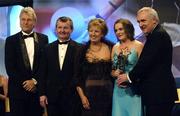 19 November 2005; Briege Corkery, from Cork, 2nd from right, is presented with her All Star award by An Taoiseach Bertie Ahern TD, and Geraldine Giles, President of the Ladies Gaelic Football Association, in the company of Tony Towell of O'Neills, left, and Pol O Gallchoir of TG4, 2nd from left, at the O'Neills TG4 Ladies GAA All-Star Awards. Citywest Hotel, Dublin. Picture credit: Ray McManus / SPORTSFILE