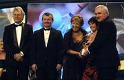 19 November 2005; Leona Tector, from Wexford, 2nd from right, is presented with her All Star award by An Taoiseach Bertie Ahern TD, and Geraldine Giles, President of the Ladies Gaelic Football Association, in the company of Tony Towell of O'Neills, left, and Pol O Gallchoir of TG4, 2nd from left, at the O'Neills TG4 Ladies GAA All-Star Awards. Citywest Hotel, Dublin. Picture credit: Ray McManus / SPORTSFILE