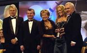 19 November 2005; Angela Walsh, from Cork, 2nd from right, is presented with her All Star award by An Taoiseach Bertie Ahern TD, and Geraldine Giles, President of the Ladies Gaelic Football Association, in the company of Tony Towell of O'Neills, left, and Pol O Gallchoir of TG4, 2nd from left, at the O'Neills TG4 Ladies GAA All-Star Awards. Citywest Hotel, Dublin. Picture credit: Ray McManus / SPORTSFILE