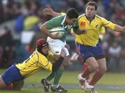 26 November 2005; Kieran Campbell, Ireland, is tackled by Catalin Fercu, left and Ionut Dimofte, Romania. permanent tsb International Friendly 2005-2006, Ireland v Romania, Lansdowne Road, Dublin. Picture credit: Brian Lawless / SPORTSFILE