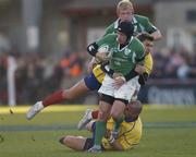 26 November 2005; David Humphreys, Ireland, is tackled by Ionut Dimofte and Florin Corodeanu, Romania. permanent tsb International Friendly 2005-2006, Ireland v Romania, Lansdowne Road, Dublin. Picture credit: Brian Lawless / SPORTSFILE
