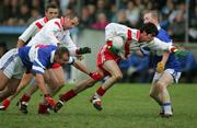 27 November 2005; Breandan Breathnach, An Ghaeltacht, in action against Ger Crotty and Noel O'Shea, St. Senans Kilkee. Munster Club Senior Football Championship Semi-Final, St. Senans Kilkee v An Ghaeltacht, Cooraclare, Co. Clare. Picture credit: Kieran Clancy / SPORTSFILE
