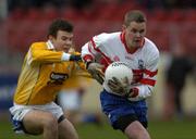 27 November 2005; Gavin Diamond, Bellaghy, in action against Andrew McLean, St. Galls. Ulster Club Senior Football Championship Final, Bellaghy v St. Galls, Healy Park, Omagh, Co. Tyrone. Picture credit: Damien Eagers / SPORTSFILE