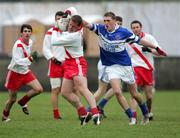 27 November 2005; Dara O Cinneide, An Ghaeltacht, in action against Kevin Larkin, St. Senans Kilkee. Munster Club Senior Football Championship Semi-Final, St. Senans Kilkee v An Ghaeltacht, Cooraclare, Co. Clare. Picture credit: Kieran Clancy / SPORTSFILE