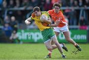 6 April 2014; Odhran Mac Niallais, Donegal, in action against Stephen Campbell, Armagh. Allianz Football League, Division 2, Round 7, Armagh v Donegal, Athletic Grounds, Armagh. Picture credit: Brendan Moran / SPORTSFILE
