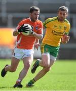 6 April 2014; Eugene McVerry, Armagh, in action against Christy Toye, Donegal. Allianz Football League, Division 2, Round 7, Armagh v Donegal, Athletic Grounds, Armagh. Picture credit: Brendan Moran / SPORTSFILE