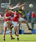 6 April 2014; David Moran, left, and Peter Crowley, Kerry, in action against Fintan Goold, left, and Paul Kerrigan, Cork. Allianz Football League, Division 1, Round 7, Kerry v Cork. Austin Stack Park, Tralee, Co. Kerry. Picture credit: Diarmuid Greene / SPORTSFILE