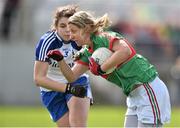 6 April 2014; Cora Staunton, Mayo, in action against Ciara McDermott, Monaghan. TESCO Ladies National Football League, Round 7, Mayo v Monaghan, James Stephen's Park, Ballina, Co. Mayo. Picture credit: David Maher / SPORTSFILE
