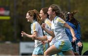 6 April 2014; UCD players, from right to left, Caroline Hill, captain Sarah Greene and Emily Beatty celebrate at the final whistle. Irish Senior Women's Hockey League Final, UCD v Railway Union, Banbridge Hockey Club, Banbridge, Co. Antrim.  Picture credit: Ramsey Cardy / SPORTSFILE