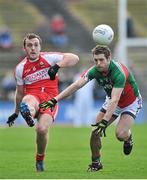 6 April 2014; Emmet McGuckin, Derry, in action against Tom Parsons, Mayo. Allianz Football League, Division 1, Round 7, Mayo v Derry, Elverys MacHale Park, Castlebar, Co. Mayo. Picture credit: Ray Ryan / SPORTSFILE