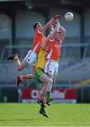 6 April 2014; Stephen Harold, left, and Kieran Toner, Armagh, contest a kickout with David Walsh, Donegal. Allianz Football League, Division 2, Round 7, Armagh v Donegal, Athletic Grounds, Armagh. Picture credit: Brendan Moran / SPORTSFILE