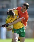 6 April 2014; Leo McLoone, Donegal, in action against Stephen harold, Armagh. Allianz Football League, Division 2, Round 7, Armagh v Donegal, Athletic Grounds, Armagh. Picture credit: Brendan Moran / SPORTSFILE