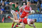 6 April 2014; Alan Freeman, Mayo, in action against Conor McAtamney and Niall Holly, Derry. Allianz Football League, Division 1, Round 7, Mayo v Derry, Elverys MacHale Park, Castlebar, Co. Mayo. Picture credit: Ray Ryan / SPORTSFILE