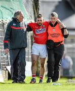 6 April 2014; Colm O'Driscoll, Cork, is helped off the pitch by Dr. Con Murphy, left, and chartered physiotherapist Colin Lane, after he picked up an injury. Allianz Football League, Division 1, Round 7, Kerry v Cork. Austin Stack Park, Tralee, Co. Kerry. Picture credit: Diarmuid Greene / SPORTSFILE