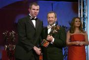 25 November 2005; Michael McCarthy, from Kerry, is presented with his Vodafone All-Star award by Sean Kelly, President of the GAA, at the 2005 Vodafone GAA All-Star Awards. Citywest Hotel, Dublin. Picture credit: Brendan Moran / SPORTSFILE