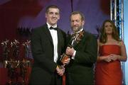 25 November 2005; Philip Jordan, from Tyrone, is presented with his Vodafone All-Star award by Sean Kelly, President of the GAA, at the 2005 Vodafone GAA All-Star Awards. Citywest Hotel, Dublin. Picture credit: Brendan Moran / SPORTSFILE
