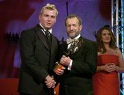 25 November 2005; Owen Mulligan, from Tyrone, is presented with his Vodafone All Star award by Sean Kelly, President of the GAA, at the 2005 Vodafone GAA All-Star Awards. Citywest Hotel, Dublin. Picture credit: Brendan Moran / SPORTSFILE