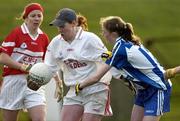 27 November 2005; Lynda Martin, Donaghmoyne, clears under pressure from Natalia Hyland, Ballyboden St. Enda's. Ladies Club All-Ireland Senior Football Championship Final, Ballyboden St. Enda's v Donaghmoyne, County Grounds, Drogheda, Co. Louth. Picture credit: Ray McManus / SPORTSFILE