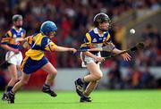 6 June 1999; Shane Kearney of Tipperary in action against Ian Colleran of Clare during the Primary Game at half-time during the Guinness Munster Senior Hurling Championship Semi-Final match between Clare and Tipperary at Páirc Uí Chaoimh in Cork. Photo by Ray McManus/Sportsfile