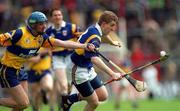 6 June 1999; Ray Killeen of Tipperary in action against Dermot Daly of Clare during the Munster Intermediate Hurling Championship match between Clare and Tipperary at Páirc Uí Chaoimh in Cork. Photo by Ray McManus/Sportsfile