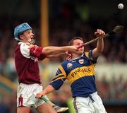 16 May 1999; Brian O'Meara of Tipperary in action against Paul Hardiman of Galway during the Church & General National Hurling League Division 1 Final match between Galway and Tipperary at Cusack Park in Ennis, Clare. Photo by Brendan Moran/Sportsfile