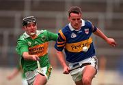 22 May 1999; Brian O'Meara of Tipperary in action against David Slattery of Kerry during the Guinness Munster Senior Hurling Championship Quarter-Final match between Tipperary and Kerry at Semple Stadium in Thurles, Tipperary. Photo by Brendan Moran/Sportsfile
