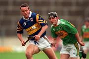 22 May 1999; Brian O'Meara of Tipperary gets past David Slattery of Kerry during the Guinness Munster Senior Hurling Championship Quarter-Final match between Tipperary and Kerry at Semple Stadium in Thurles, Tipperary. Photo by Brendan Moran/Sportsfile