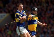 6 June 1999; Frank Lohan of Clare blocks a shot by Brian O'Meara of Tipperary during the Guinness Munster Senior Hurling Championship Semi-Final match between Clare and Tipperary at Páirc Uí Chaoimh in Cork. Photo by Ray McManus/Sportsfile