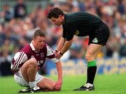 30 May 1999; Referee Brian White attends to Russell Casey of Westmeath during the Bank of Ireland Leinster Senior Football Championship 2nd Preliminary Round match between Westmeath and Longford at Cusack Park in Mullingar, Westmeath. Photo by Aoife Rice/Sportsfile