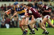 16 May 1999; Conal Bonnar of Tipperary, in action against Ollie Fahey, centre, and Mark Kerins, behind, of Galway during the Church & General National Hurling League Division 1 Final match between Galway and Tipperary at Cusack Park in Ennis, Clare. Photo by Ray McManus/Sportsfile