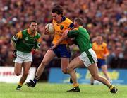 30 May 1999; Conor Connelly of Roscommon in action against Padraig Flynn of Leitrim during the Bank of Ireland Connacht Senior Football Championship at Páirc Sheáin Mhic Dhiarmada in Carrick on Shannon, Leitrim. Photo by Brendan Moran/Sportsfile