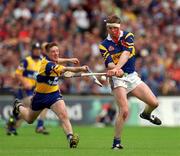 6 June 1999; Conor Gleeson of Tipperary in action against Jamesie O'Connor of Clare during the Guinness Munster Senior Hurling Championship Semi-Final match between Clare and Tipperary at Páirc Uí Chaoimh in Cork. Photo by Ray McManus/Sportsfile