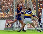 6 June 1999; David Fitzgerald of Clare in action against Paul Shelley of Tipperary during the Guinness Munster Senior Hurling Championship Semi-Final match between Clare and Tipperary at Páirc Uí Chaoimh in Cork. Photo by Ray McManus/Sportsfile