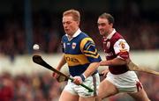 16 May 1999; Declan Ryan of Tipperary gets past Tom Kavanagh of Galway during the Church & General National Hurling League Division 1 Final match between Galway and Tipperary at Cusack Park in Ennis, Clare. Photo by Brendan Moran/Sportsfile