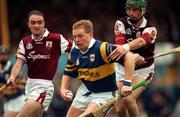 16 May 1999; Declan Ryan of Tipperary in action against Fergus Flynn, right, and Tom Kavanagh of Galway during the Church & General National Hurling League Division 1 Final match between Galway and Tipperary at Cusack Park in Ennis, Clare. Photo by Brendan Moran/Sportsfile