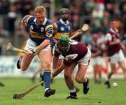 16 May 1999; Declan Ryan of Tipperary in action against Fergus Flynn of Galway during the Church & General National Hurling League Division 1 Final match between Galway and Tipperary at Cusack Park in Ennis, Clare. Photo by Brendan Moran/Sportsfile