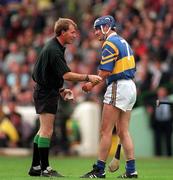 14 September 1997; Referee Dickie Murphy speaks to Conal Bonnar of Tipperary during the Guinness All-Ireland Senior Hurling Championship Final match between Clare and Tipperary at Croke Park in Dublin. Photo by Ray McManus/Sportsfile