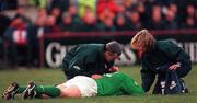 6 March 1999; Kevin Maggs of Ireland is treated for injury by Dr Donal O'Shaughnessy and physiotherapist Denise Fanagan during the Five Nations Rugby Championship match between Ireland and England at Landsdowne Road in Dublin. Photo by Brendan Moran/Sportsfile